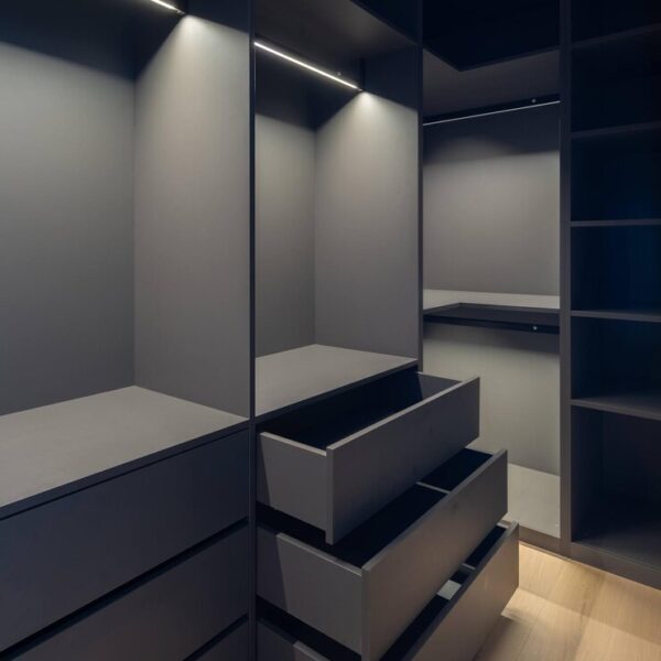 Sleek Matte Black Walk-In Wardrobe with LED Accent Lighting